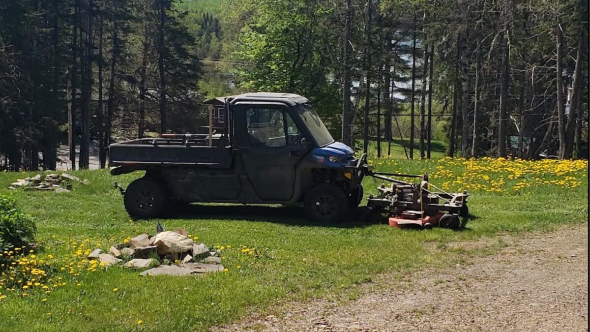 a custom side-by-side mowing the lawn